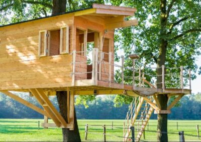 Tree house built in two trees in a farm